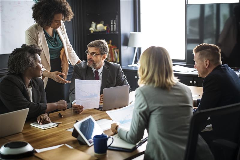 People on a beach with different fragments of photos surrounding them